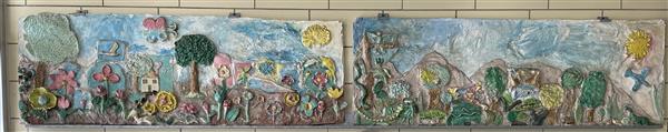 A two-piece ceramic and cement wall sculpture created by sixth-graders